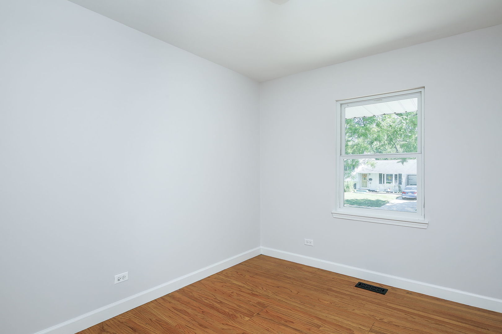 458 White Pine Road Buffalo Grove, IL 60089 - Photo 16 of 25 an empty room with wooden floor and windows
