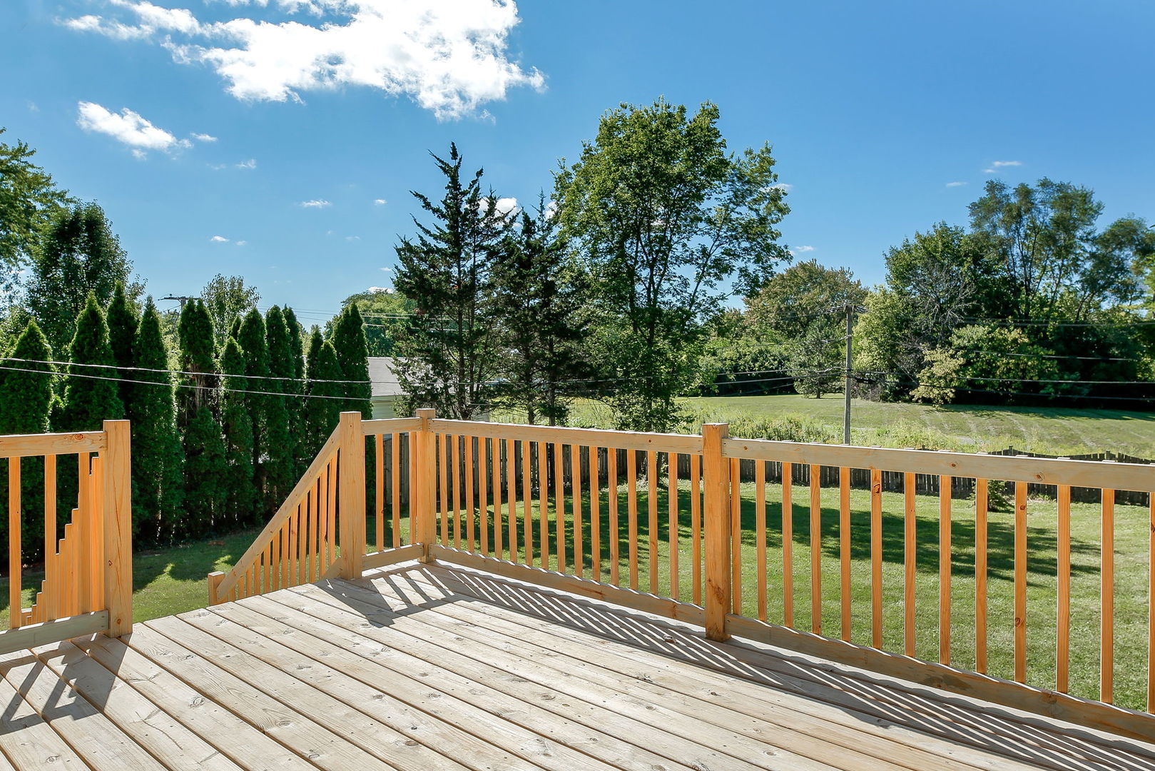 458 White Pine Road Buffalo Grove, IL 60089 - Photo 22 of 25 a view of balcony with wooden floor and fence