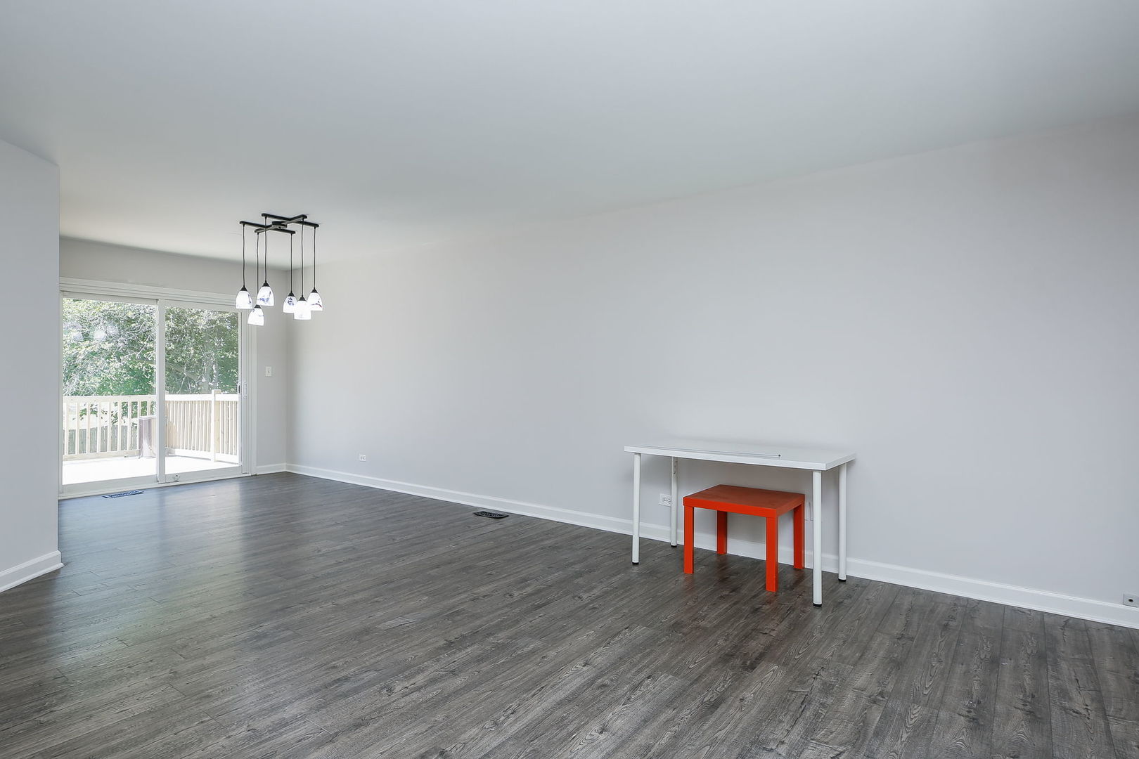 458 White Pine Road Buffalo Grove, IL 60089 - Photo 6 of 25 a view of an empty room with wooden floor and a window