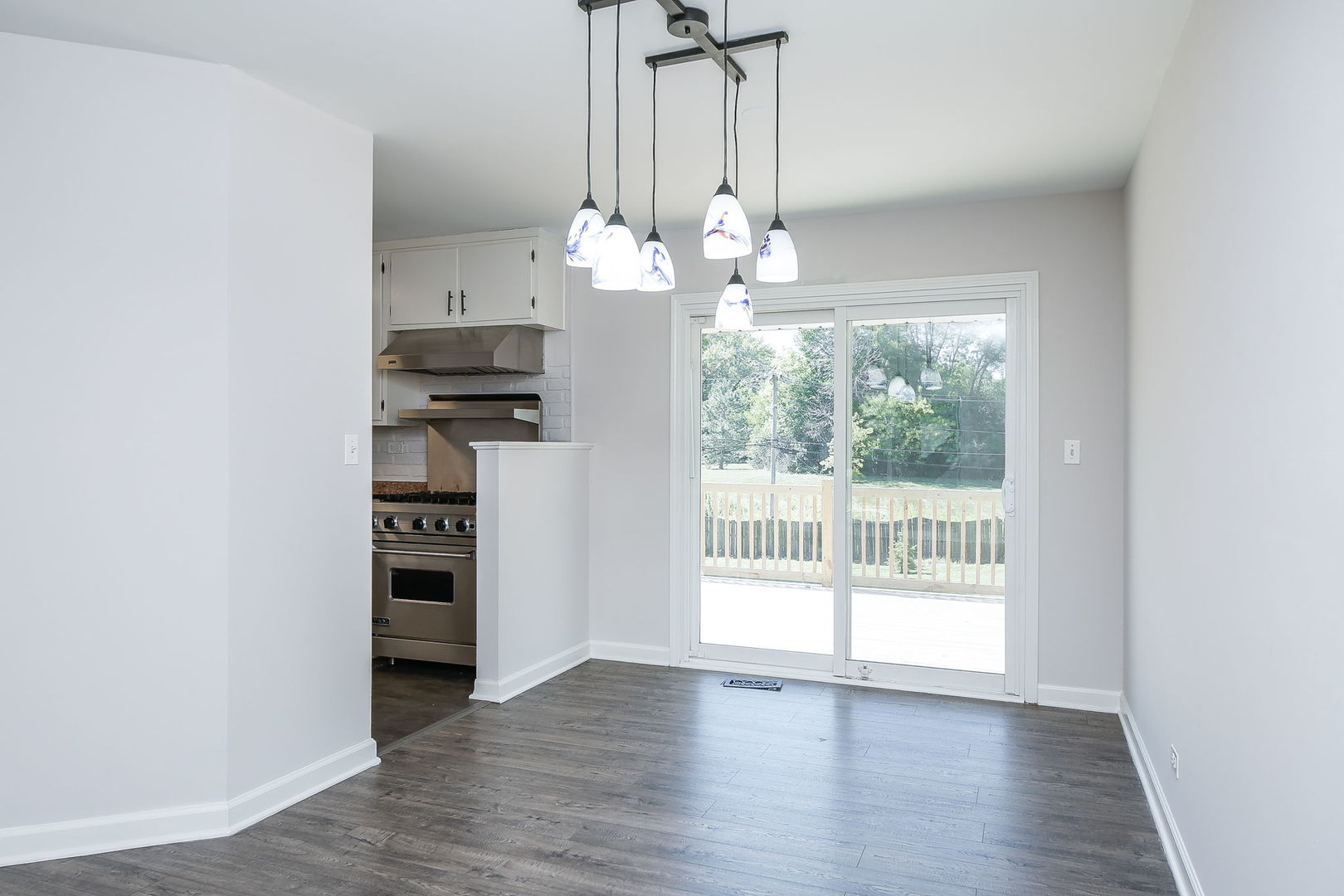 458 White Pine Road Buffalo Grove, IL 60089 - Photo 8 of 25 a view of a kitchen with wooden floor and a window