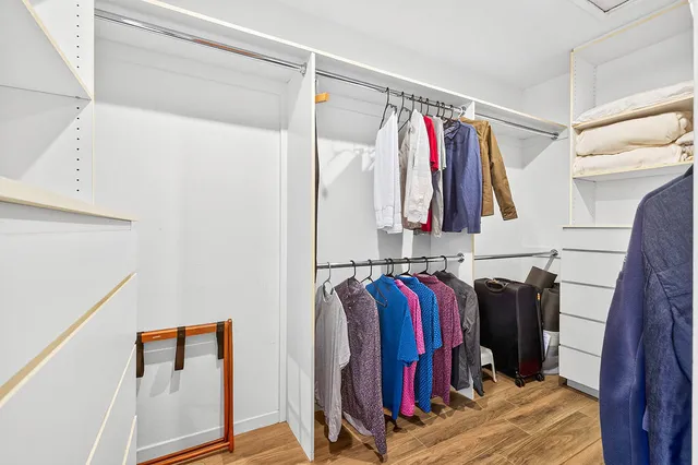 a bathroom with a double vanity sink mirror and shower