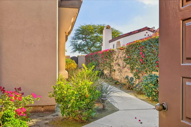 a view of a bunch of flowers in front of a house