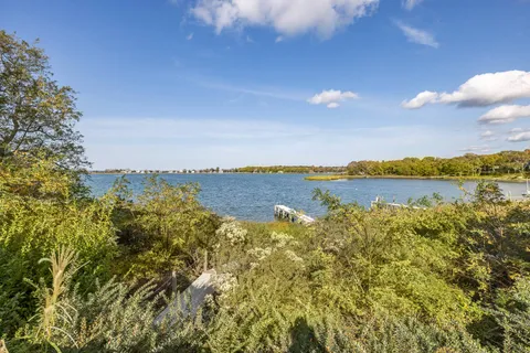 a view of lake with green space