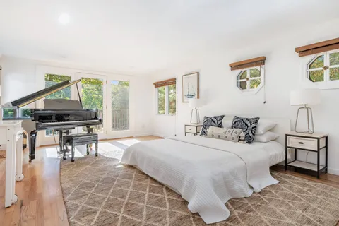 a bedroom with a bed and a table in it