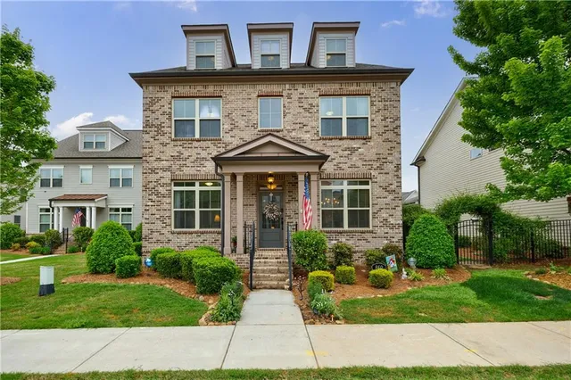 front view of a house with a yard
