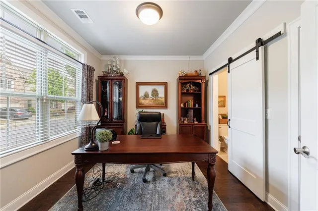 a kitchen with sink cabinets and wooden floor