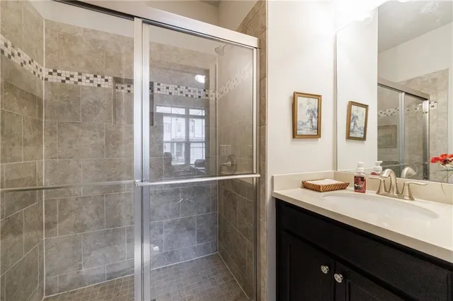 a kitchen with granite countertop a sink a counter top space a stove and stainless steel appliances