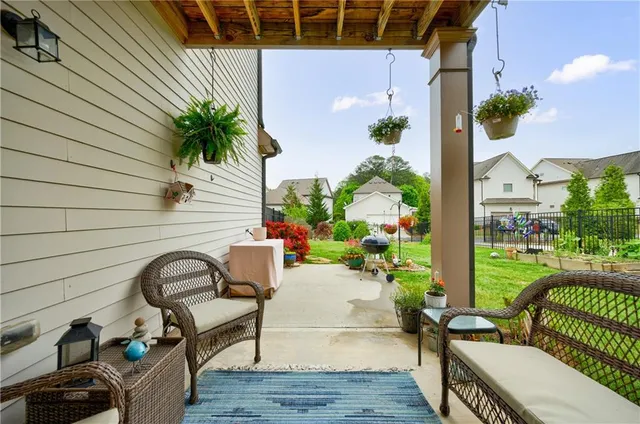 a view of a livingroom with furniture wooden floor and a window
