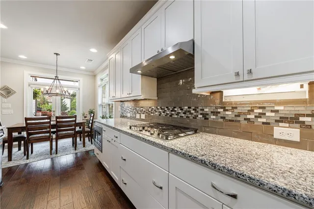a bathroom with a glass door shower a sink and a mirror