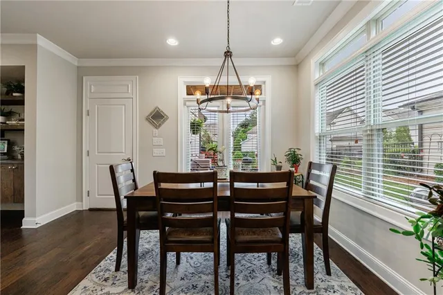 a white bath tub sitting in a bathroom next to a window