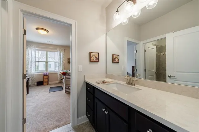 a living room with furniture a flat screen tv and a table
