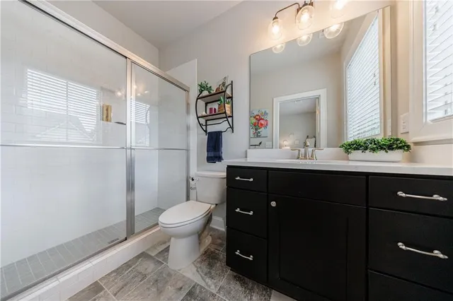 a view of a house with porch and garden