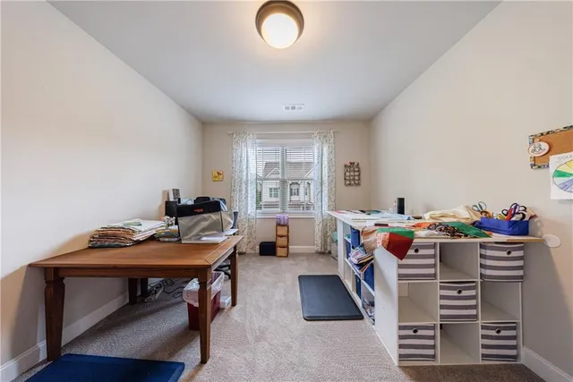a front view of a house with garden and porch