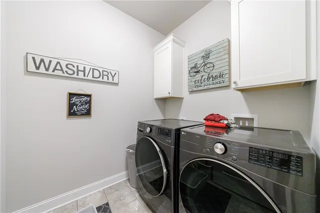 an aerial view of a house with a yard and outdoor seating