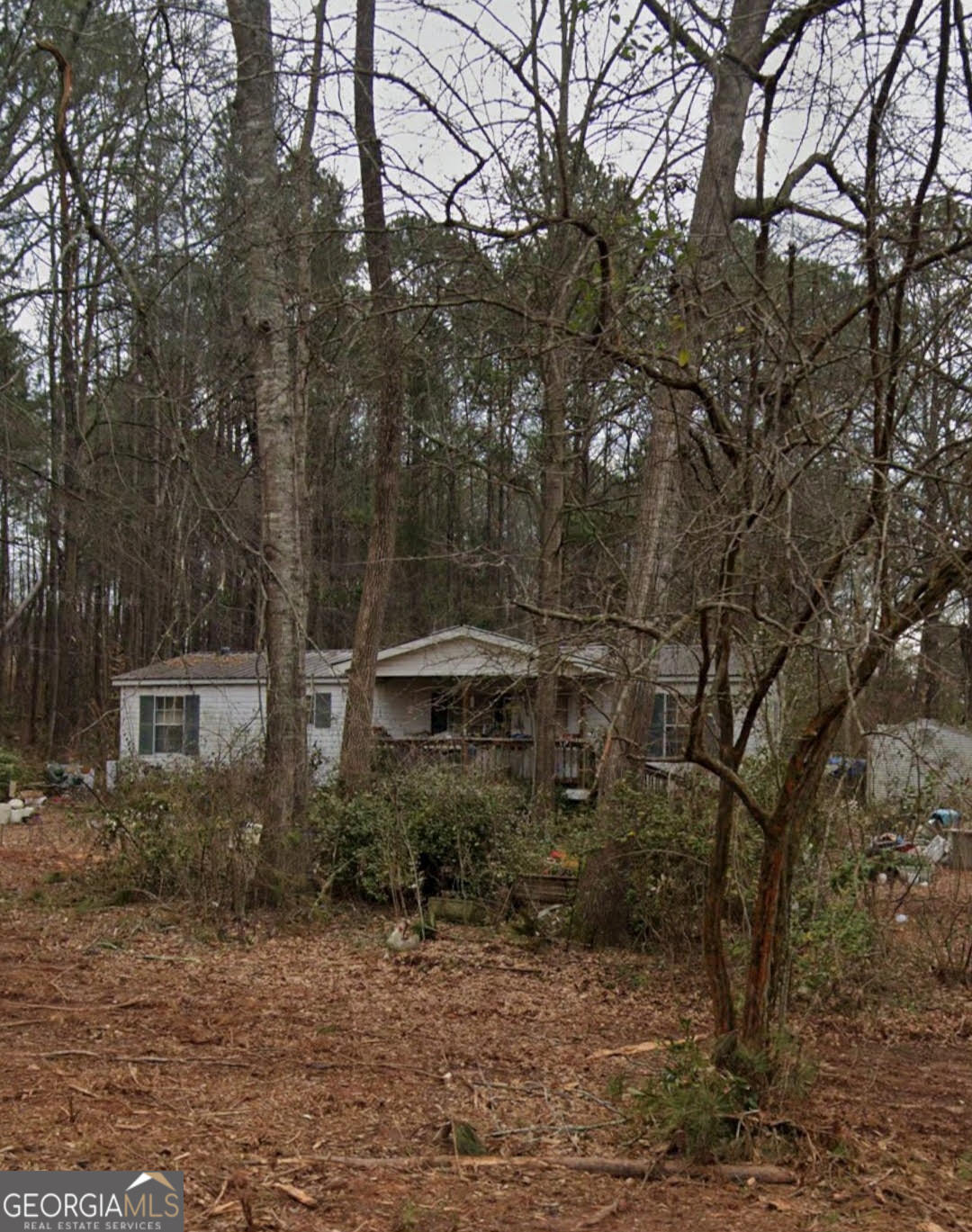 145 Southern Shores Road Jackson, GA 30233 - Photo 1 of 1 a backyard of a house with lots of green space