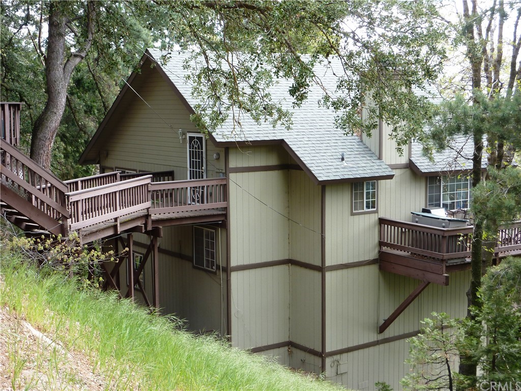 a view of a house with a yard garage and outdoor seating