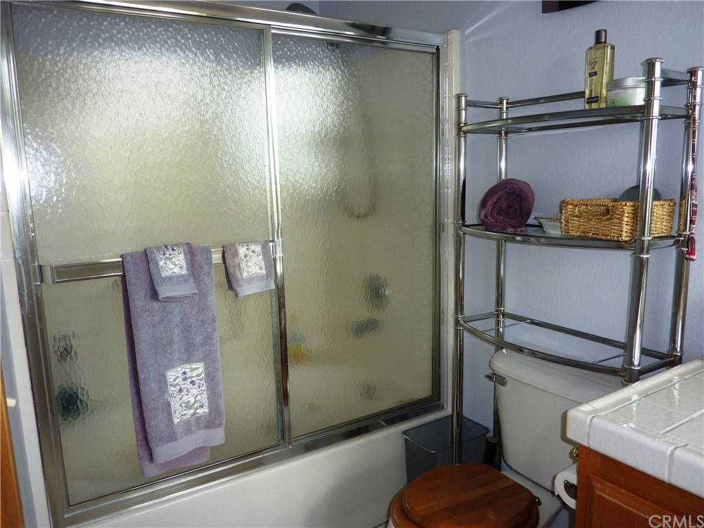 25274 N Road Twin Peaks, CA 92391 - Photo 22 of 35 a bathroom with a shower and a sink