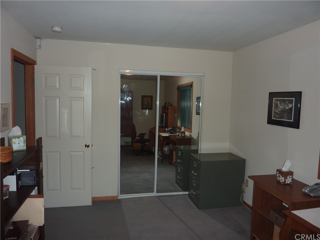 25274 N Road Twin Peaks, CA 92391 - Photo 25 of 35 a workspace with furniture and closet