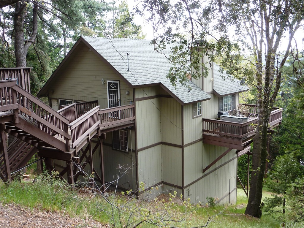 25274 N Road Twin Peaks, CA 92391 - Photo 30 of 35 a view of a house with a yard and large tree