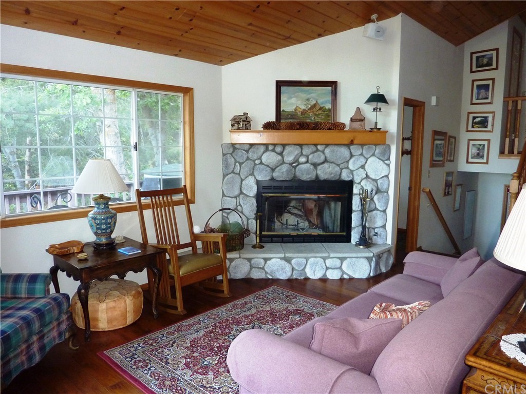 25274 N Road Twin Peaks, CA 92391 - Photo 4 of 35 a living room with furniture and a fireplace