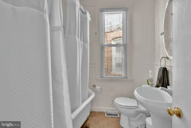 a view of room with window and workspace