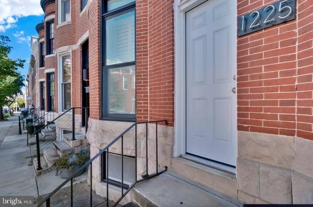 a view of a brick building with many windows