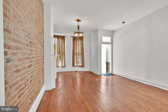 a view of a livingroom with furniture and wooden floor