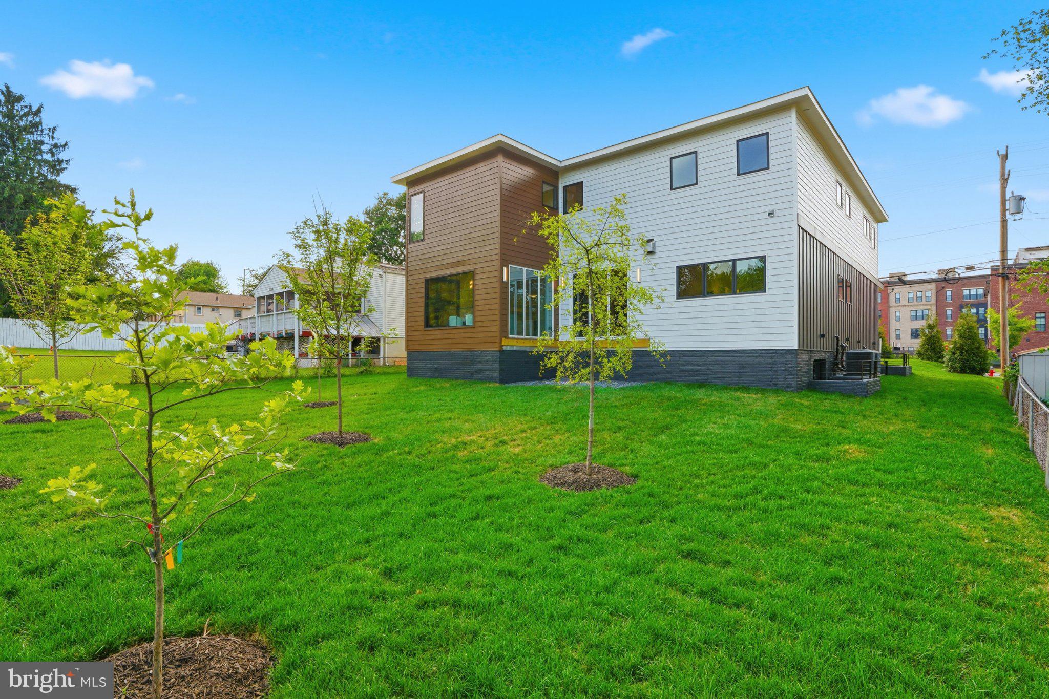 7421 Magarity Road Falls Church, VA 22043 - Photo 63 of 66 Modern home with lush green yard.