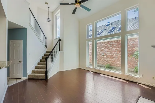 a view of an entryway with wooden floor