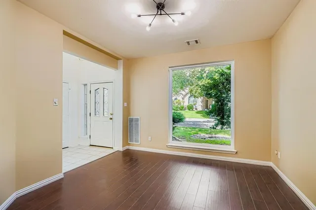 a large kitchen with granite countertop a sink dishwasher stove and cabinets