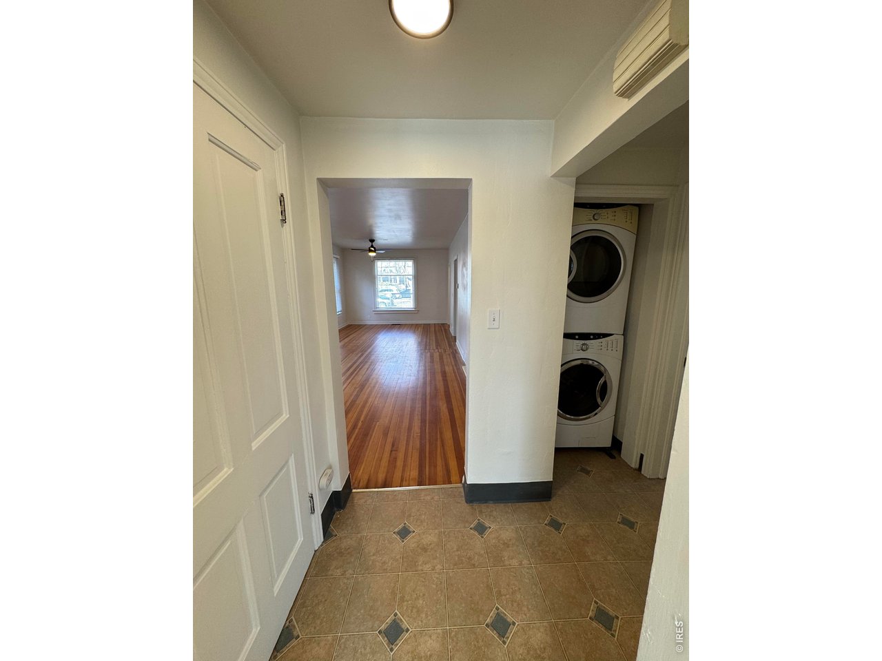612 South Howes Street Fort Collins, CO 80521 - Photo 7 of 18 a view of a hallway with wooden shelves