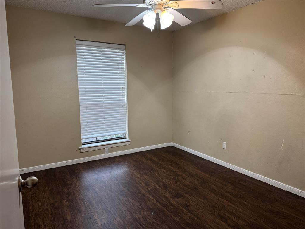 116 Ridge Crest Street Red Oak, TX 75154 - Photo 14 of 18 an empty room with wooden floor and windows