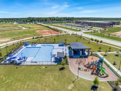 a view of a balcony with dining table and chairs