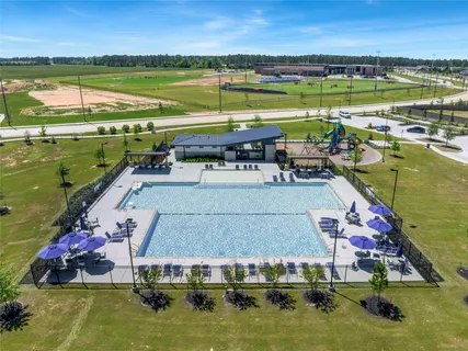 an aerial view of a house with a swimming pool