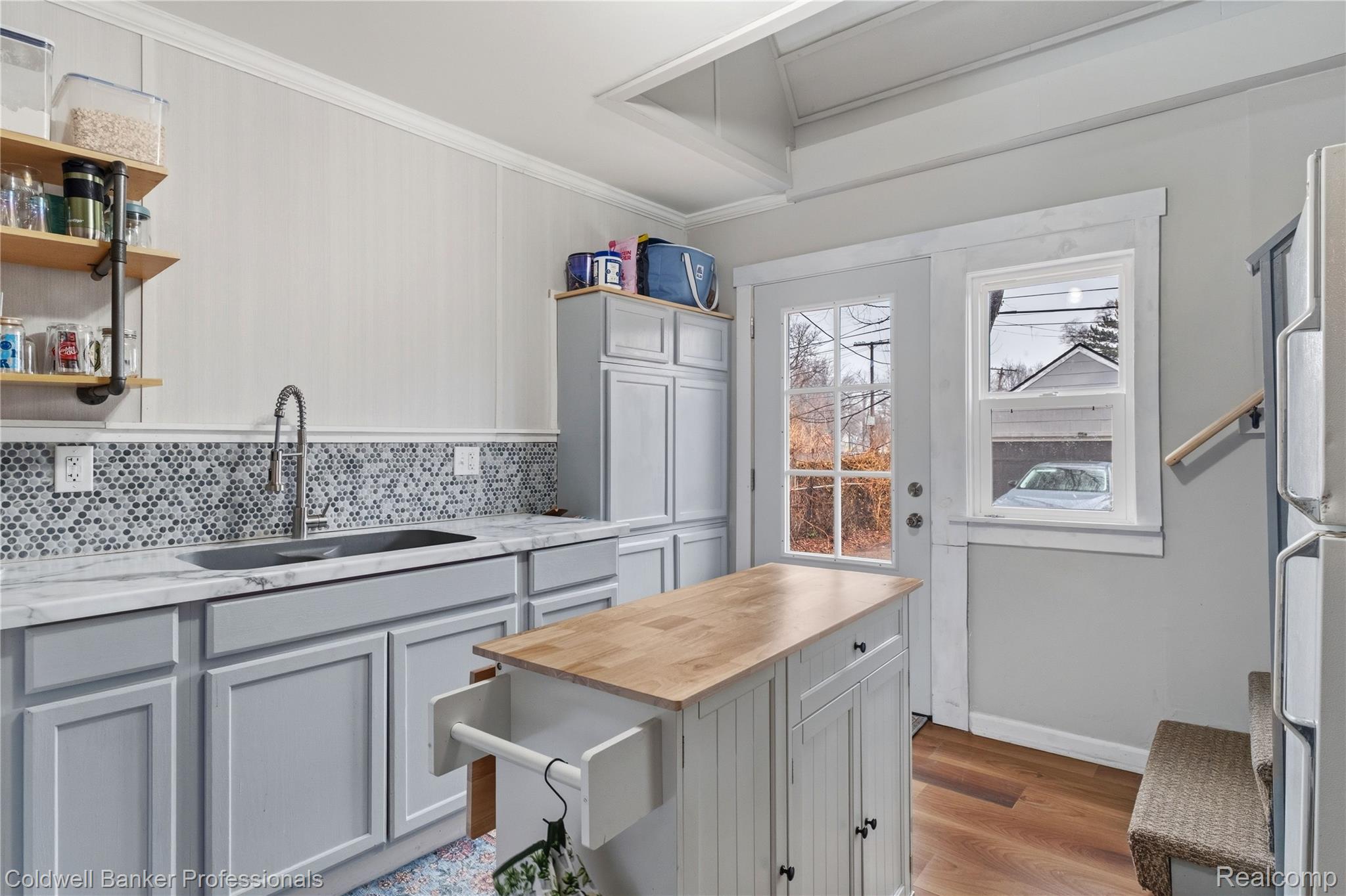 3040 Inman Street Ferndale, MI 48220 - Photo 19 of 41 Kitchen with wooden counters, tasteful backsplash, open shelves, light wood-style flooring, and gray cabinetry