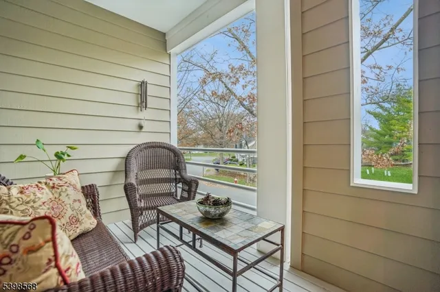 a view of a door and chair in the balcony