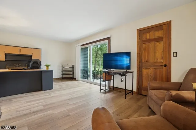 a bathroom with a granite countertop sink a toilet and a mirror