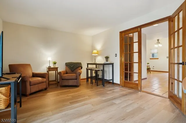 a view of a kitchen with wooden floor and a sink