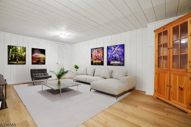 a front view of a house with a garden and trees