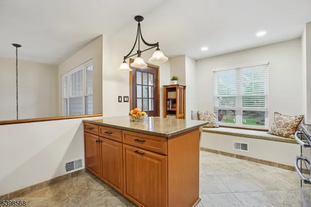 a view of a balcony with chairs and with wooden floor