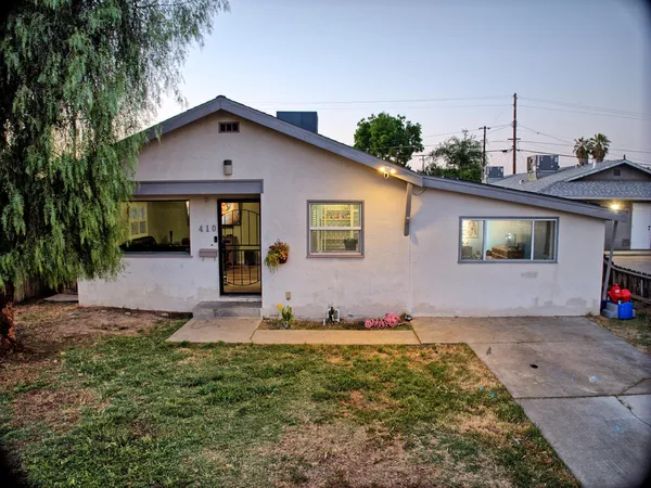 a front view of a house with yard