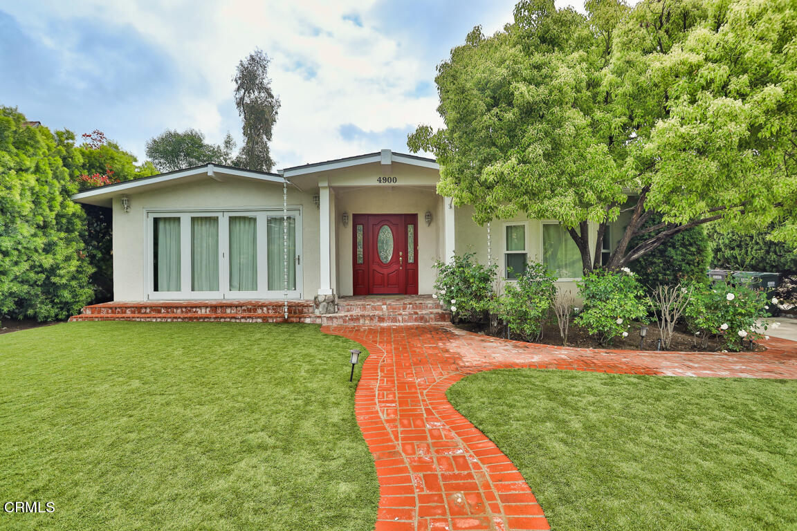 4900 Crown Avenue La Canada Flintridge, CA 91011 - Photo 1 of 41 a front view of a house with a garden and yard