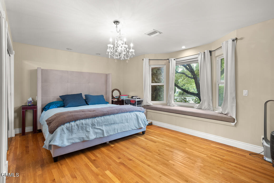 4900 Crown Avenue La Canada Flintridge, CA 91011 - Photo 21 of 41 a spacious bedroom with a large bed and a window