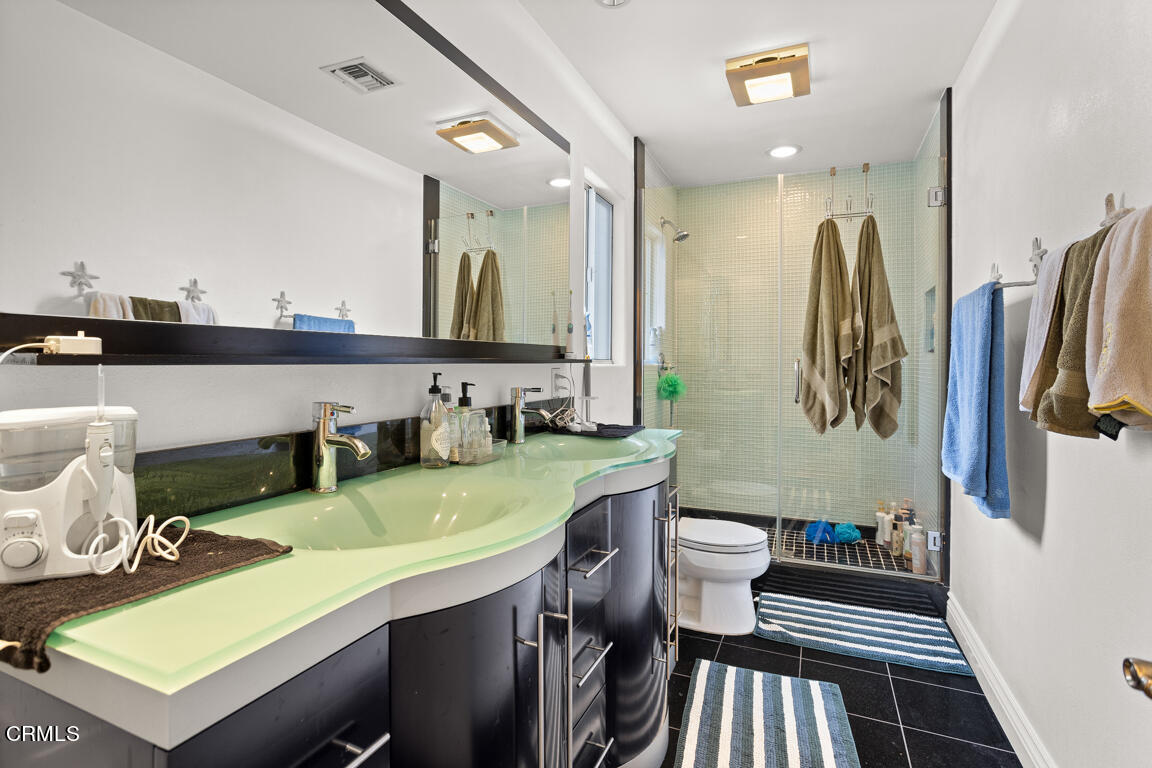 4900 Crown Avenue La Canada Flintridge, CA 91011 - Photo 24 of 41 a bathroom with a sink a toilet and mirror