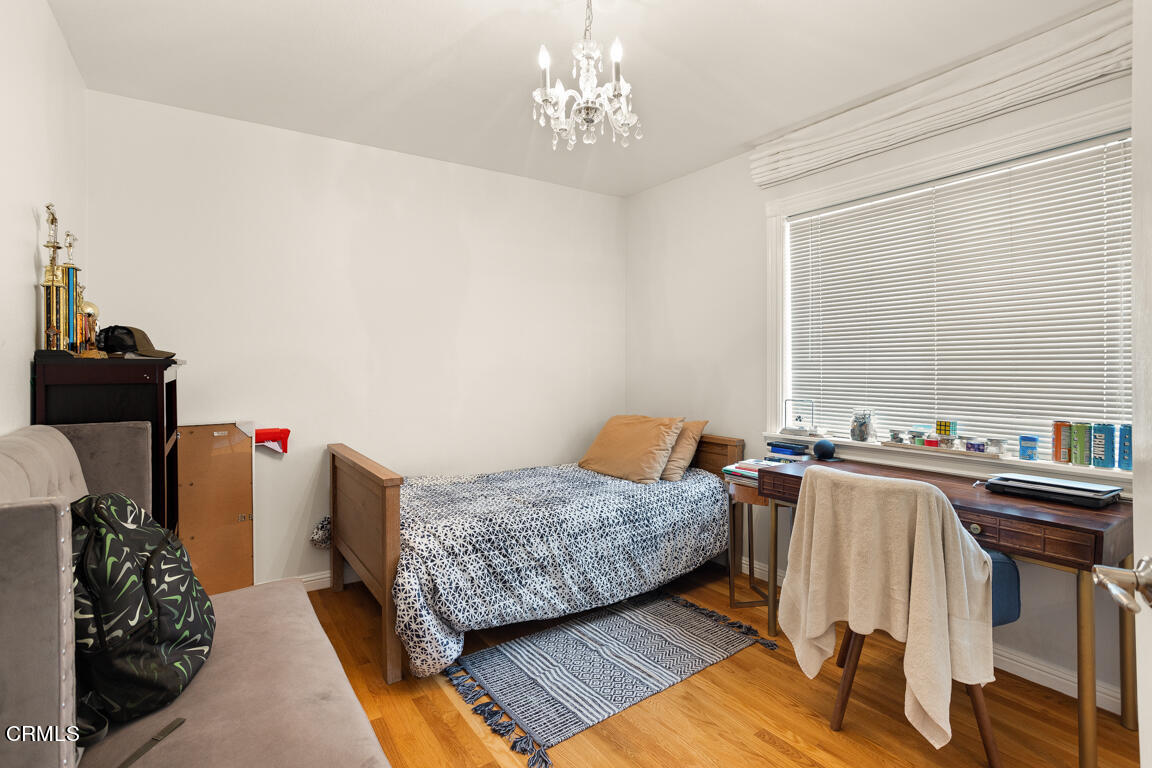 4900 Crown Avenue La Canada Flintridge, CA 91011 - Photo 29 of 41 a bedroom with furniture and a chandelier