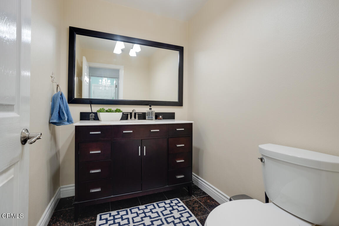 4900 Crown Avenue La Canada Flintridge, CA 91011 - Photo 33 of 41 a bathroom with a toilet sink vanity and mirror