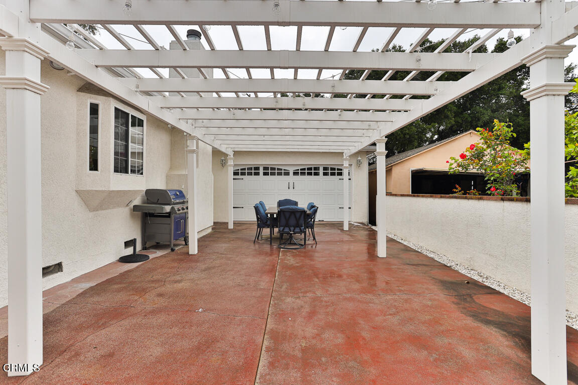 4900 Crown Avenue La Canada Flintridge, CA 91011 - Photo 40 of 41 a living room with furniture a fireplace and a table