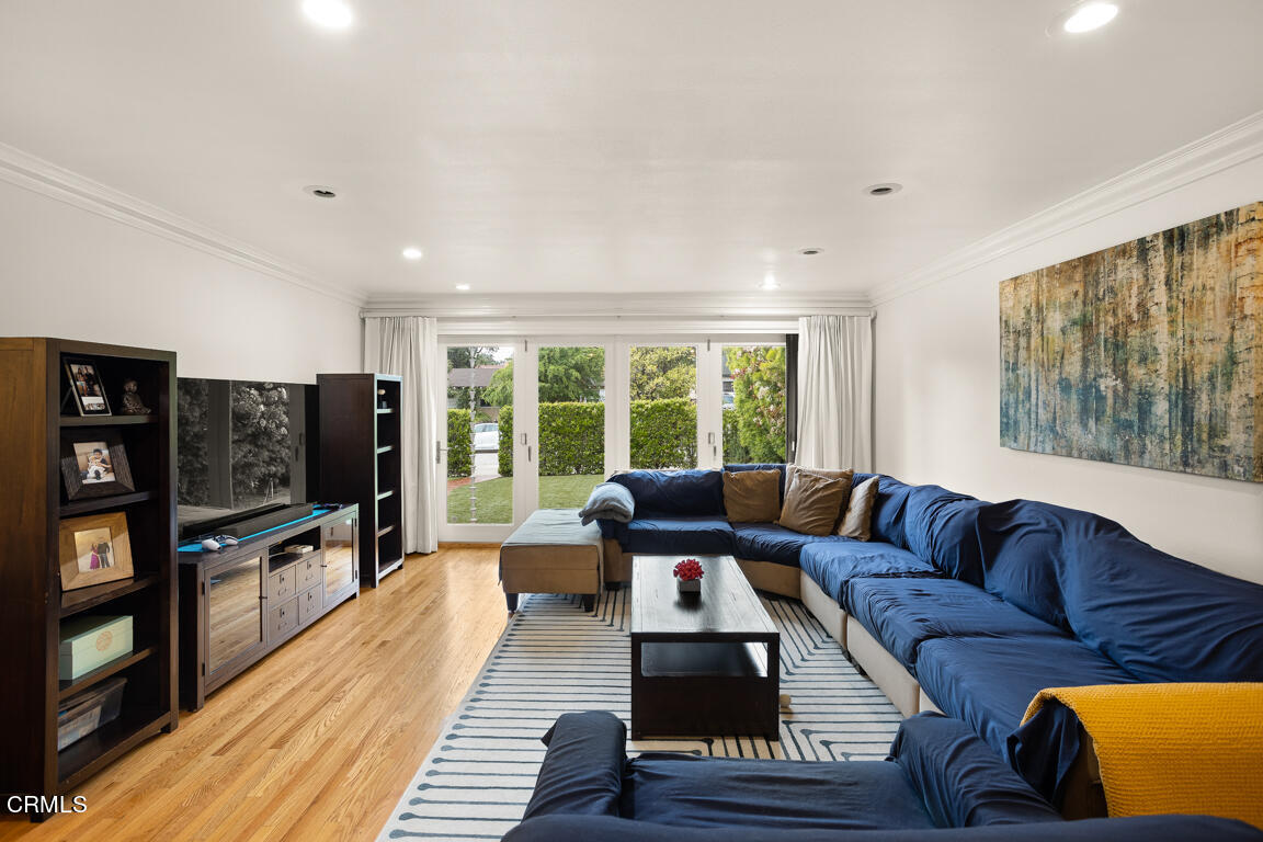 4900 Crown Avenue La Canada Flintridge, CA 91011 - Photo 4 of 41 a living room with furniture and a flat screen tv