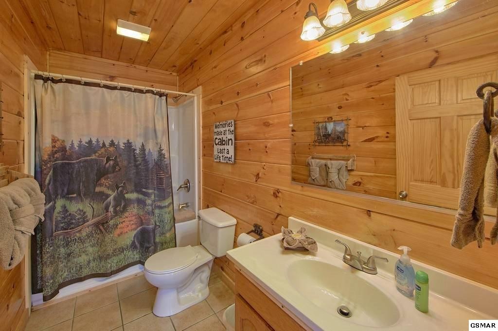 2116 Memory Way Sevierville, TN 37876 - Photo 12 of 16 a bathroom with a sink toilet and shower