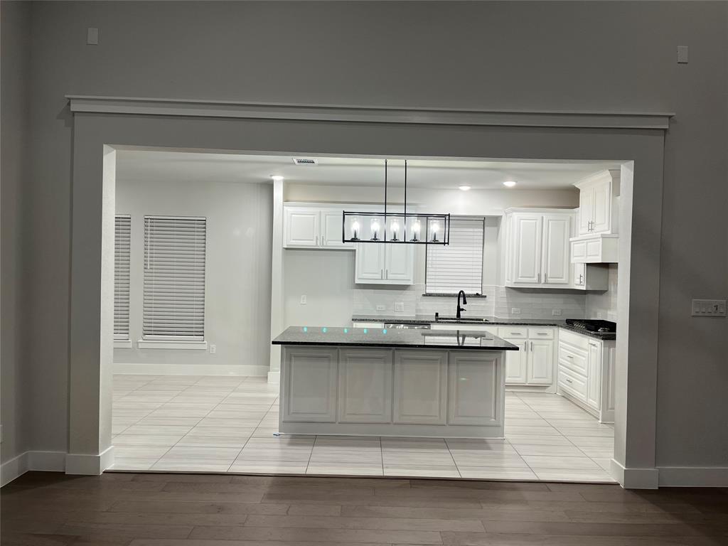 2409 Park Oaks Drive Midlothian, TX 76065 - Photo 14 of 18 a kitchen with a sink and cabinets